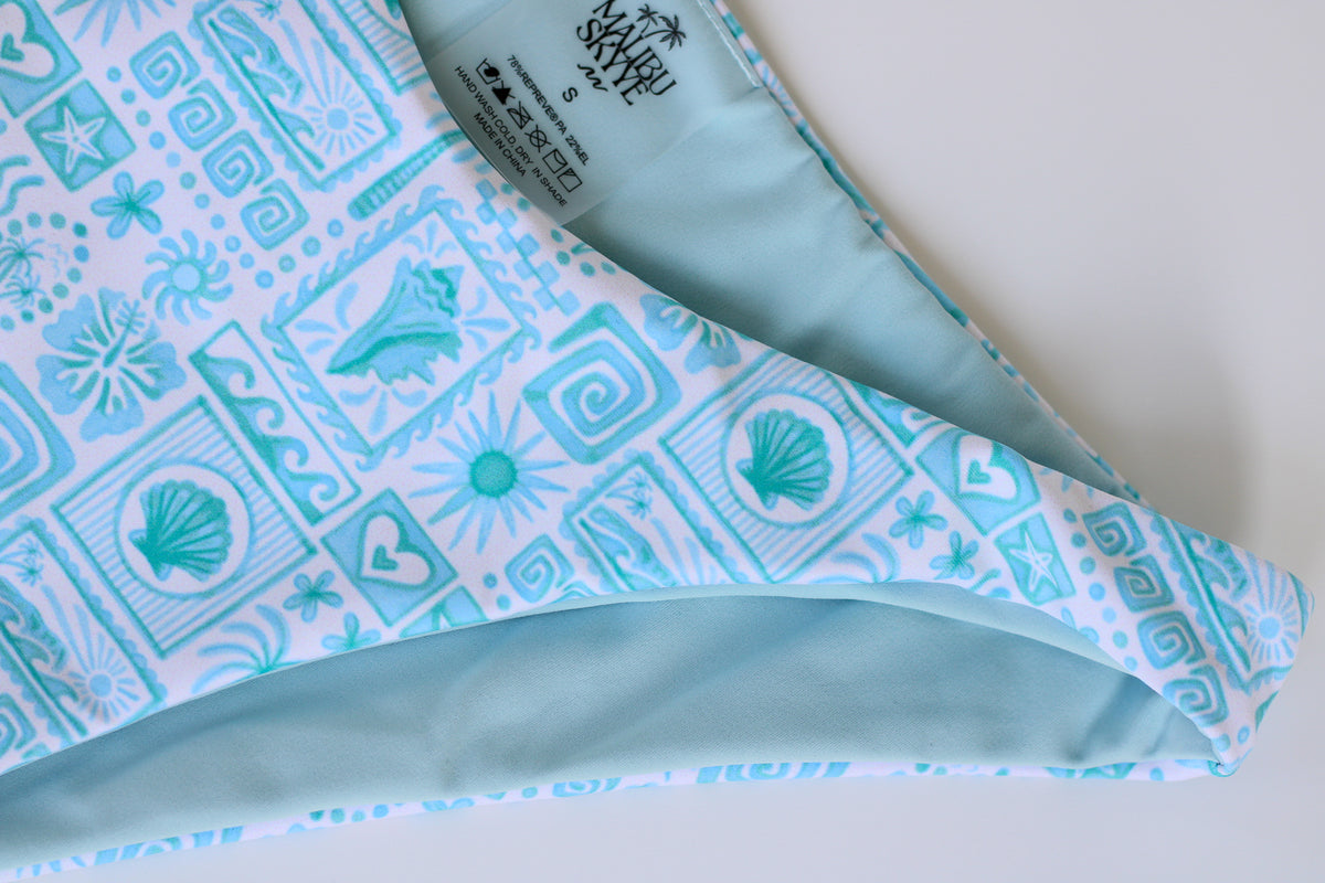 Patterned fabric with blue and white design on a white background